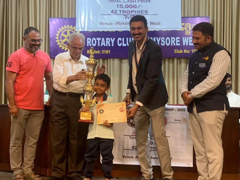 Gahan receiving a trophy and certificate at Rotary Club Mysore West Championship 2025