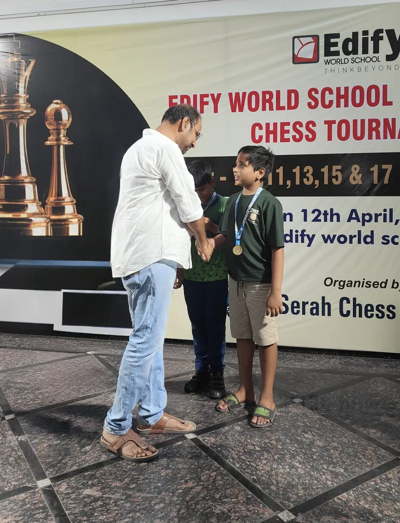 Jiyansh receiving a medal at Edify World School Chess Tournament
