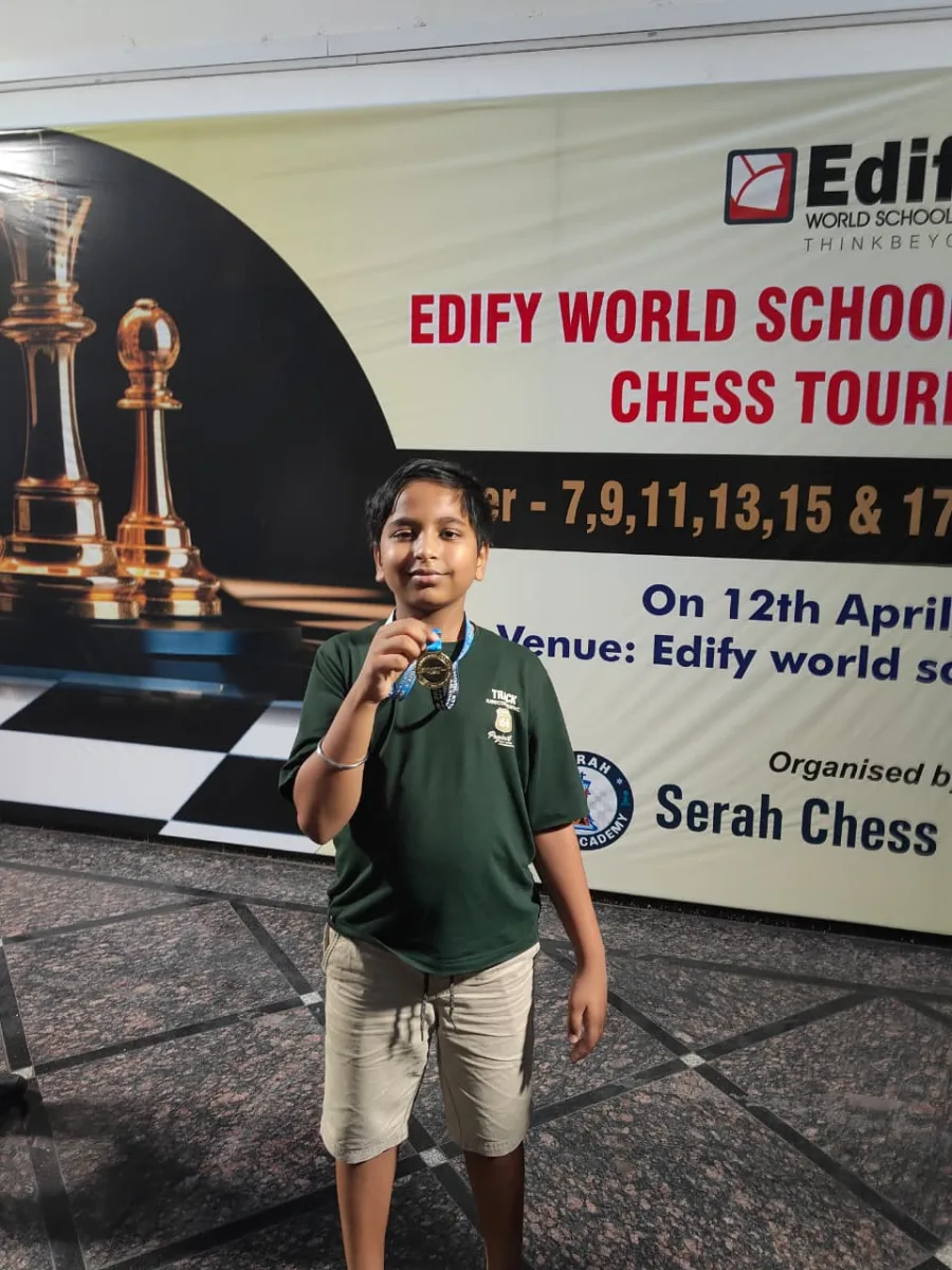 Jiyansh with a certificate at Edify World School chess event